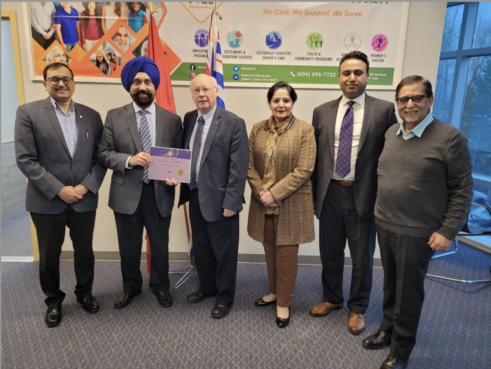 PICS Board Members (L-R - Parveen Goel, Maninder Grewal, Kam Pawar & Arvinder Bubber) and PICS's President and CEO pose for a picture with Honorable Member of Parliament Ken Hardie who presented Satbir Singh Cheema with the Queen’s Platinum Jubilee Award for outstanding service to the community.  